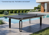 A Kettler outdoor pool table with a black playing surface and dark metal legs, positioned next to a swimming pool on a stone patio. The image includes a text overlay at the top stating '*Conversion tops only - Pool table is not included' to clarify that the listing is for the conversion tops only.